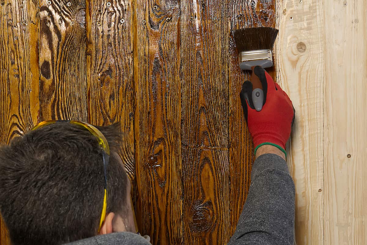 carpenter craftsman painting with brush