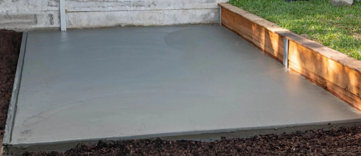 Concrete slab base for a wooden garage