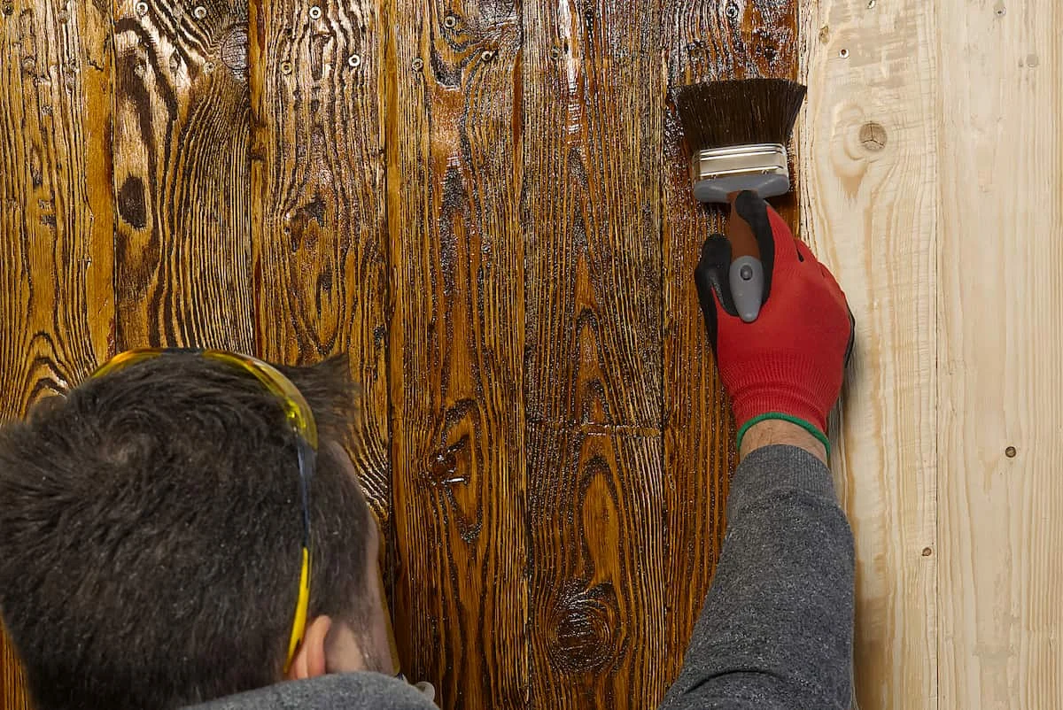 carpenter craftsman painting with brush