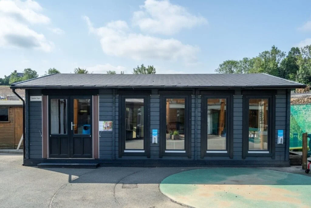Dark grey garden shed with black trim